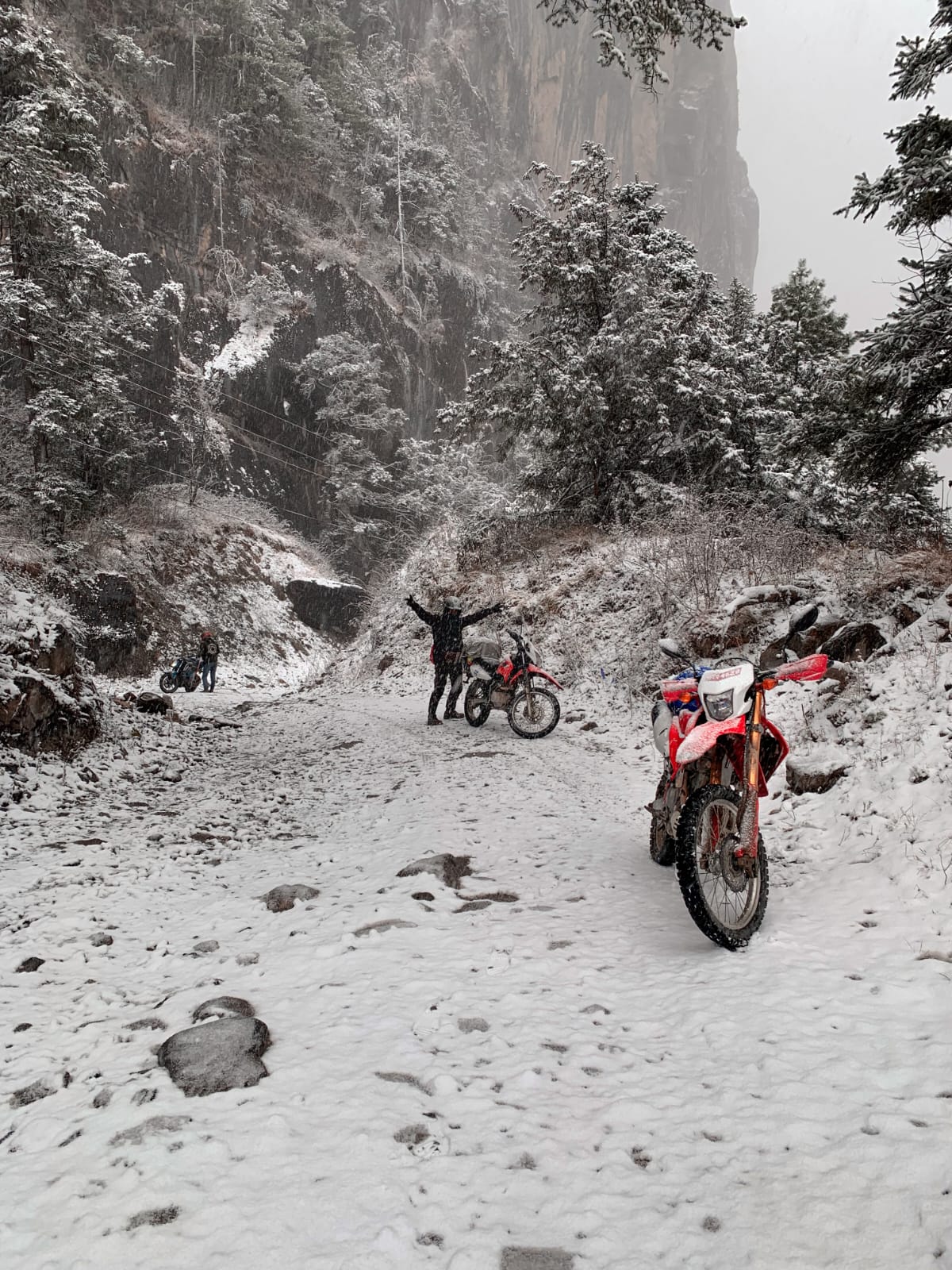 Bike parked on a snow-covered mountain road